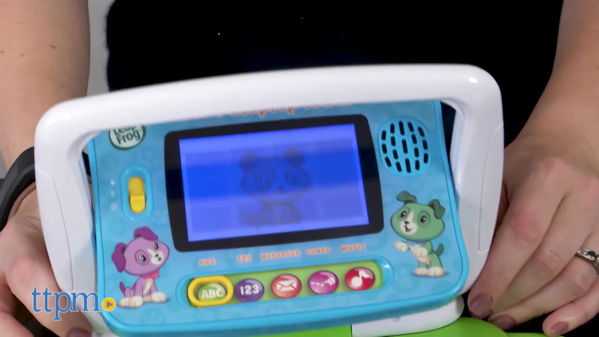 A child swiveling the screen to change the LeapTop Touch from laptop to tablet mode.