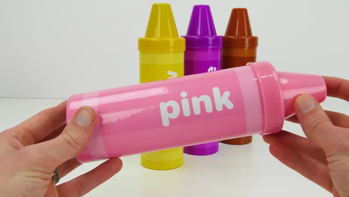 Roll out the pink Play-Doh and use cutters to create shapes.