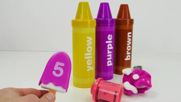 Roll out the pink Play-Doh and use cutters to create shapes.