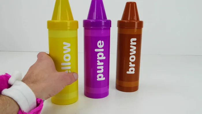 Roll out the yellow Play-Doh and use cutters to create shapes.