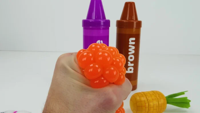 Roll out the yellow Play-Doh and use cutters to create shapes.