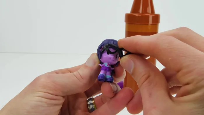 Roll out the purple Play-Doh and use cutters to create shapes.