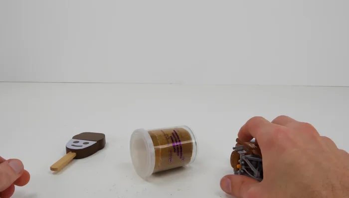 Play with the brown kinetic sand and use cutters to create shapes.