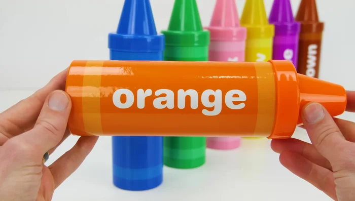 Roll out the orange Play-Doh and use cutters to create shapes.