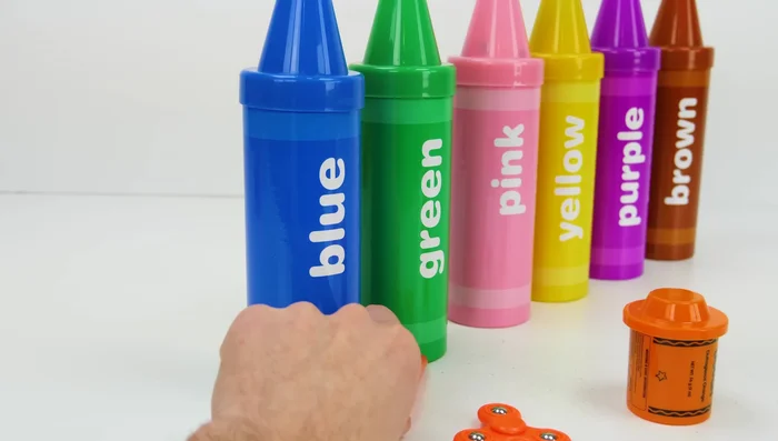 Roll out the orange Play-Doh and use cutters to create shapes.