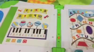 Child interacting with the LeapStart book and stylus.