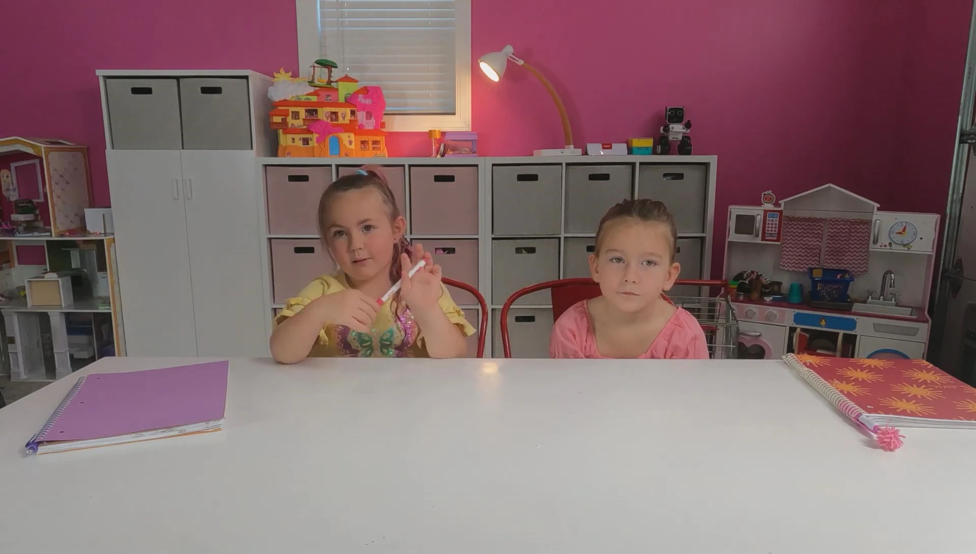 Children tracing and writing letters and words on the flash cards