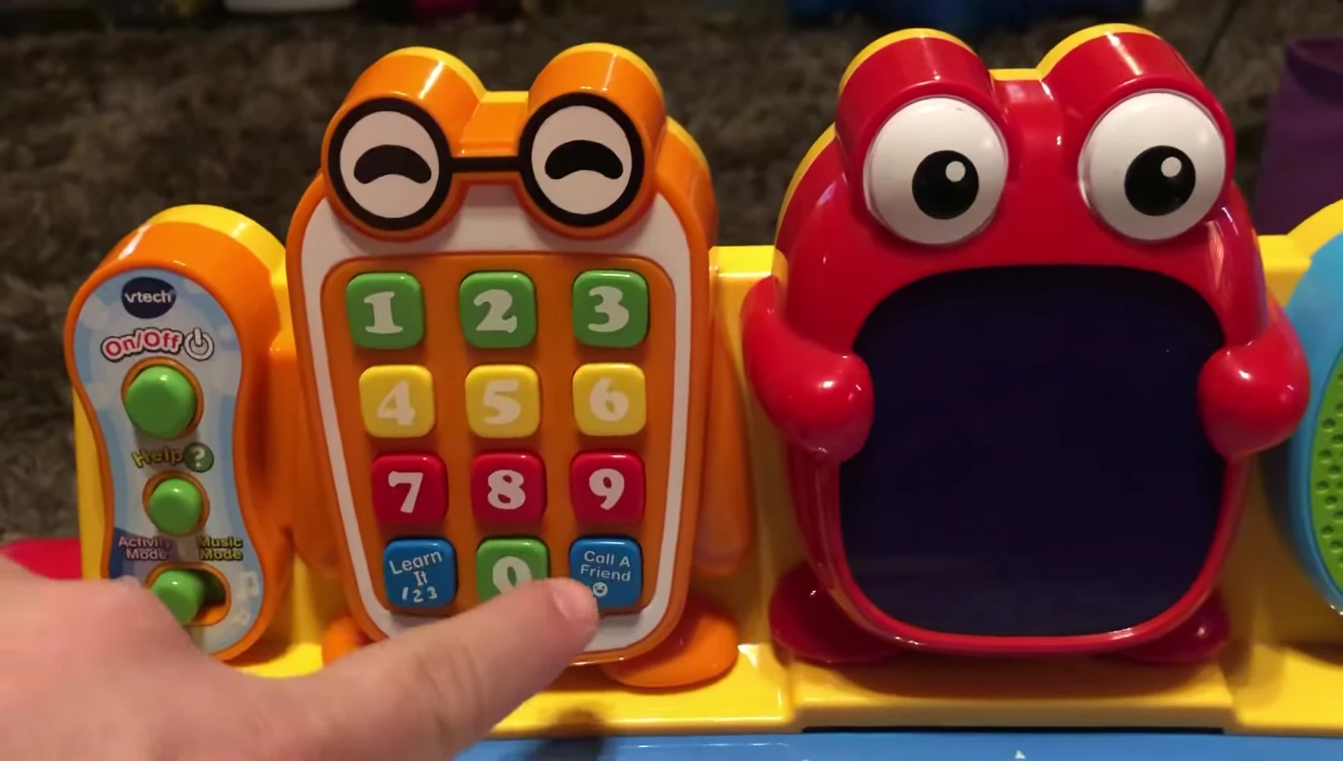 Child pressing the 'call a friend' button.