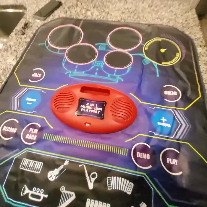 Volume Control: Adjust volume using the volume buttons on either side of the playmat (note: external device volume may need adjustment as well).