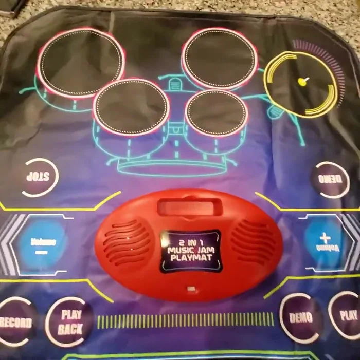 Volume Control: Adjust volume using the volume buttons on either side of the playmat (note: external device volume may need adjustment as well).