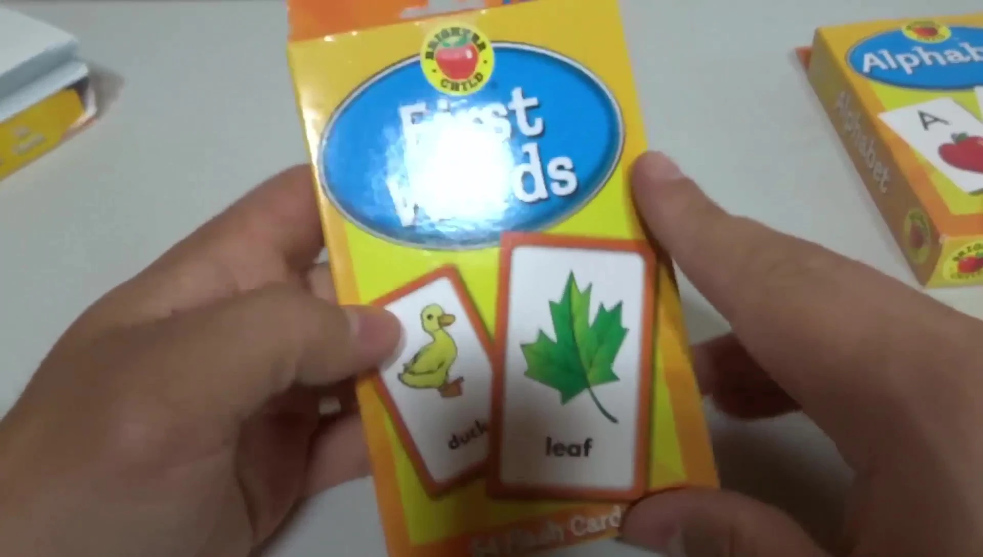 The First Words flashcard packaging showing examples