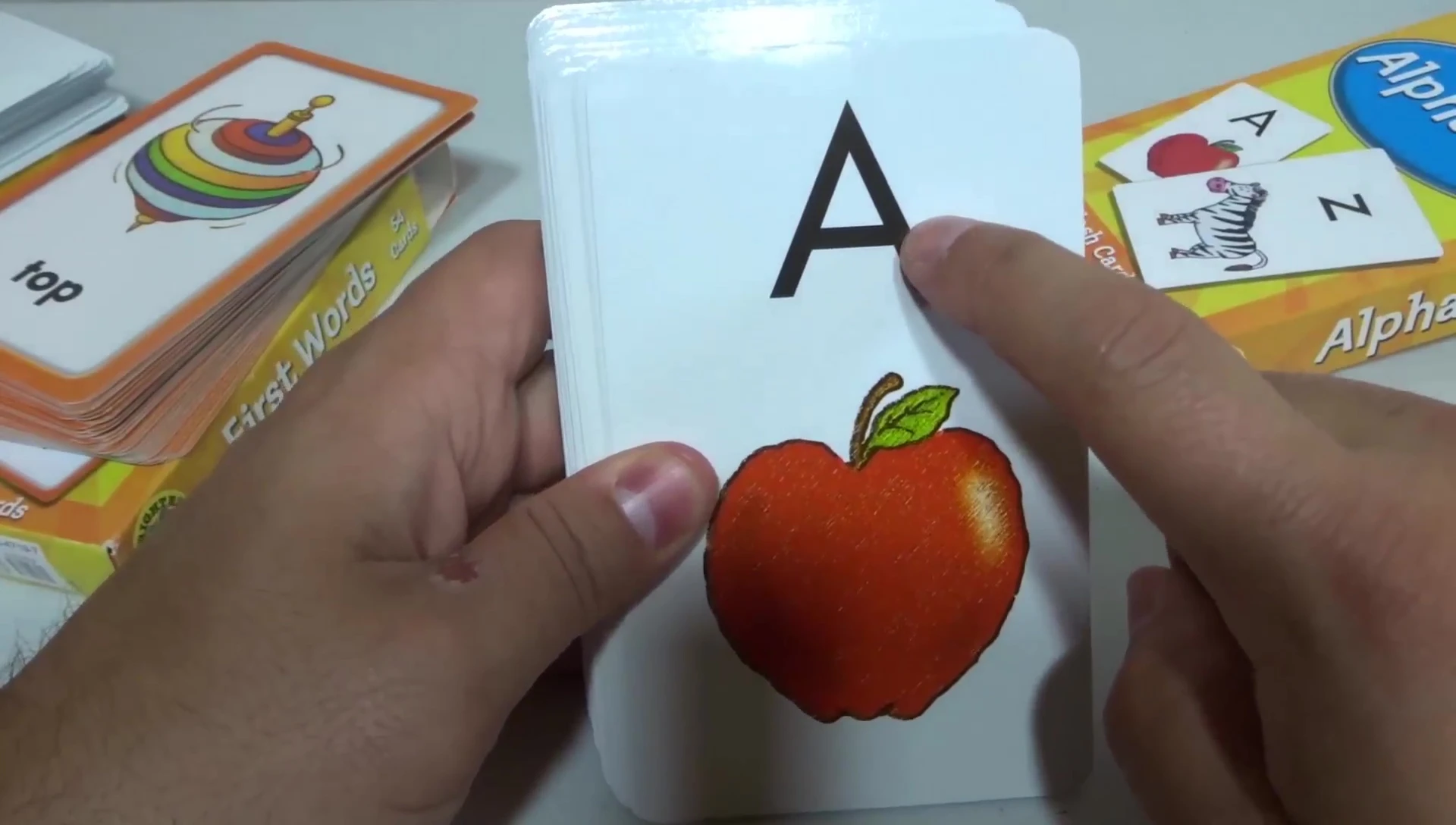 Example of an Alphabet flashcard showing the letter 'A' and an apple.