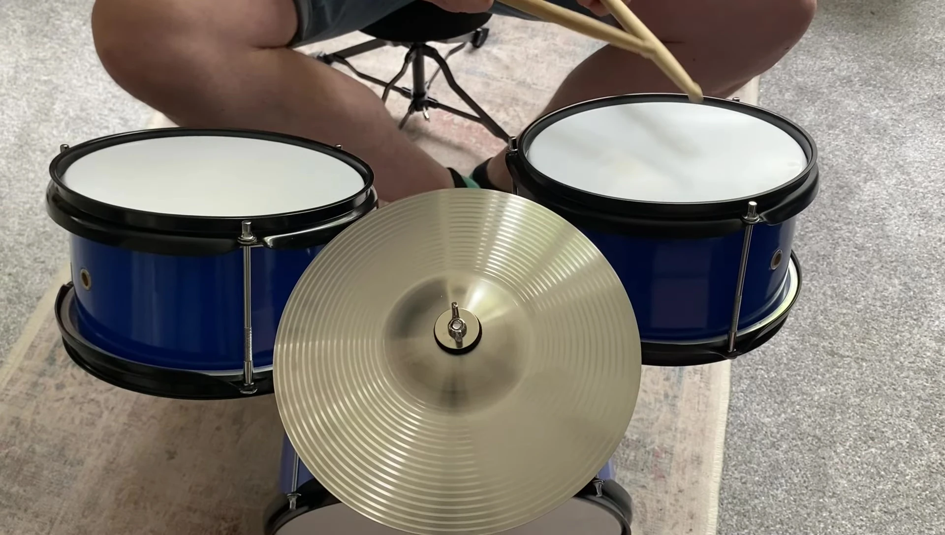Playing the assembled drum set