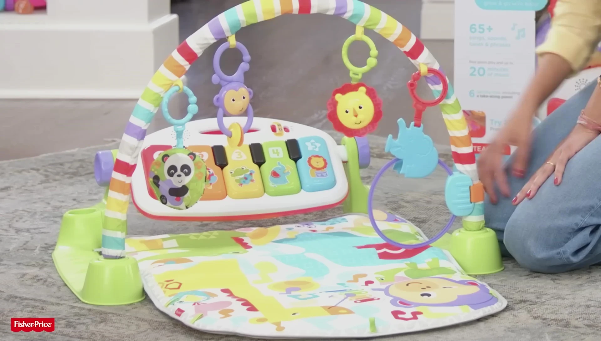 Baby lying on their back playing with the toys.