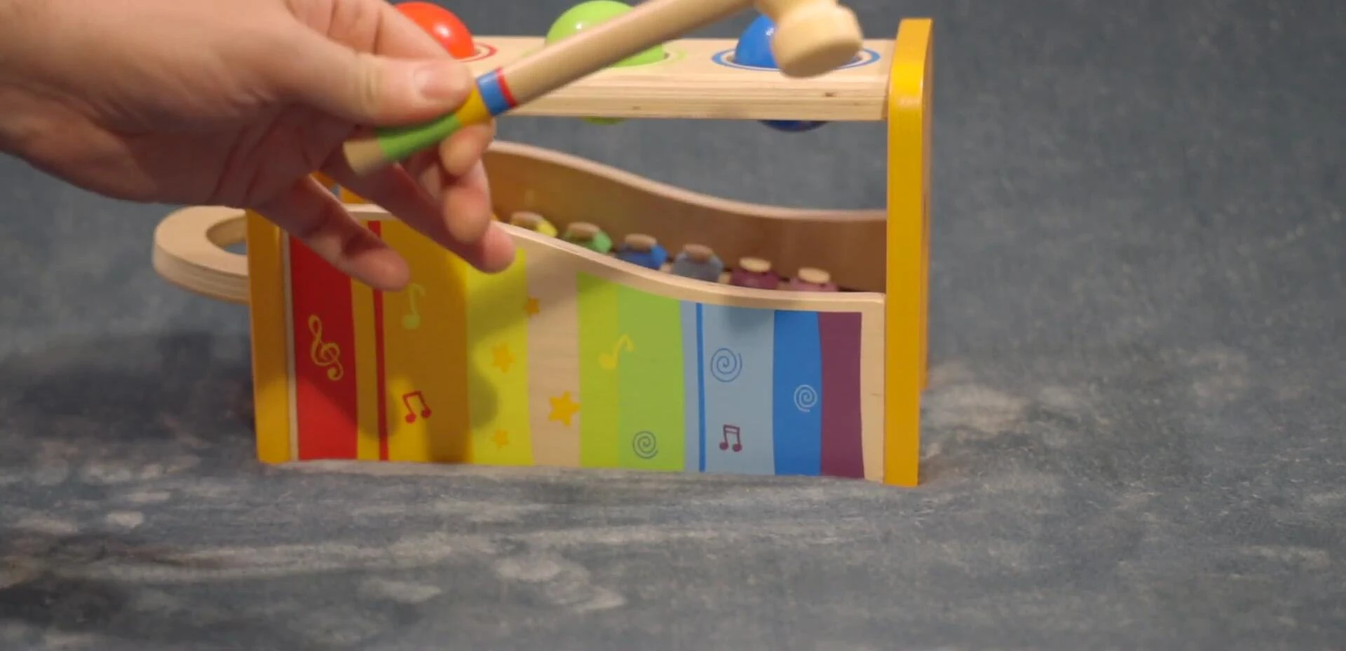 Toddler playing with the mallet