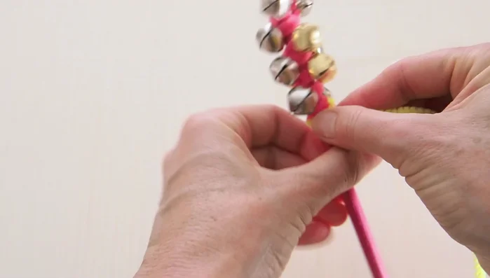 Twist the second pipe cleaner tightly at the top and tuck the ends.