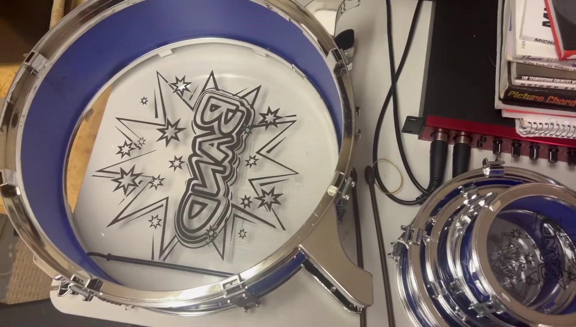 Close-up view of all the individual drum set parts laid out for assembly.
