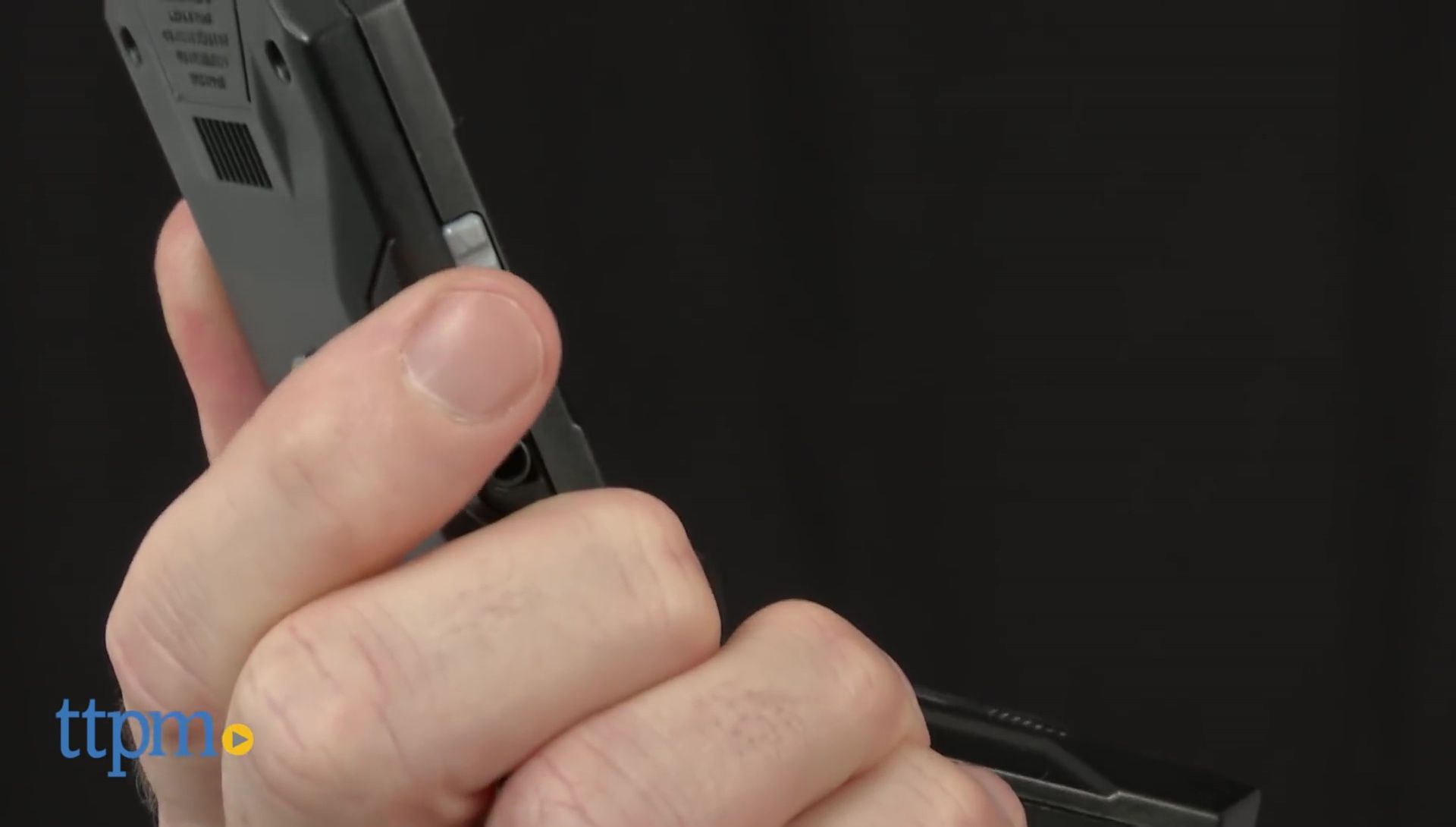 Person demonstrating the audio and video quality of the walkie-talkies.