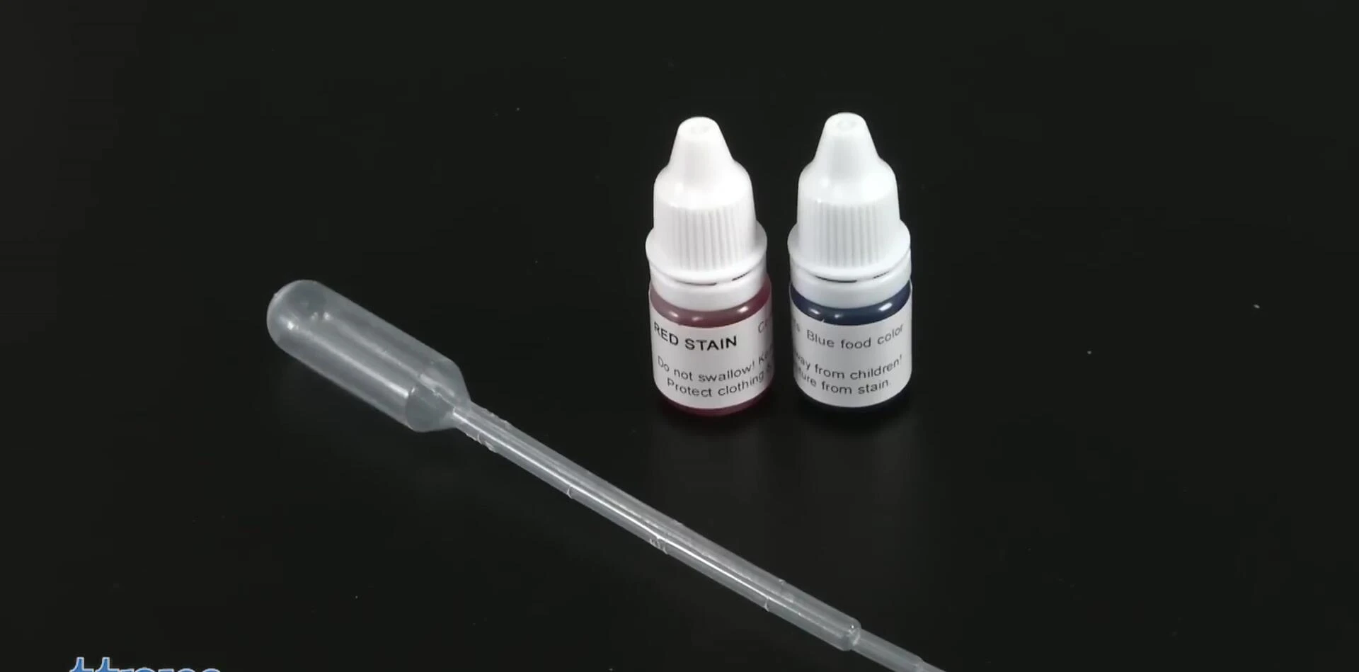 Close-up view of some of the included accessories such as forceps, test tubes, and staining solutions.