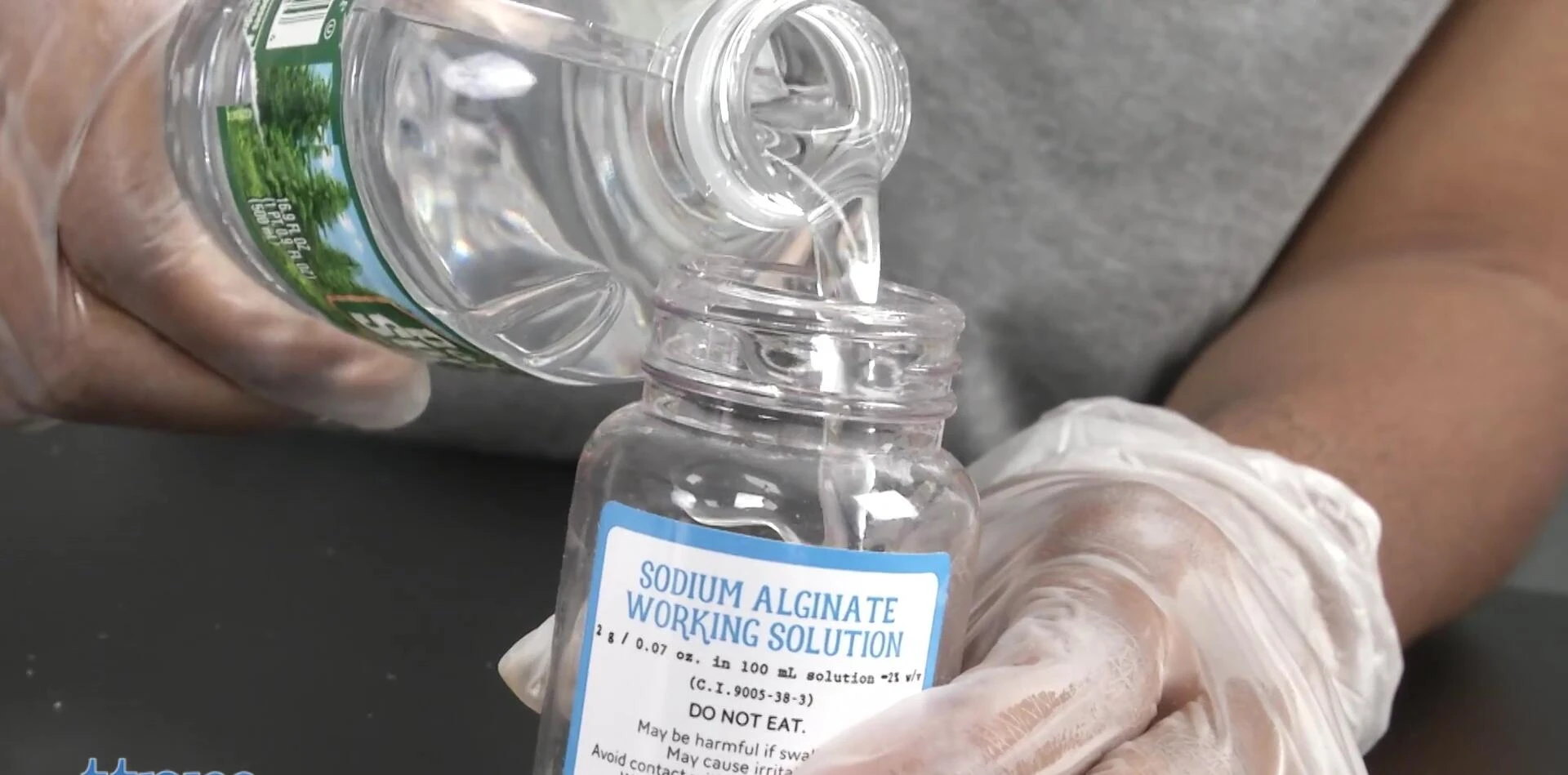 Shaking the jar containing the alginate solution