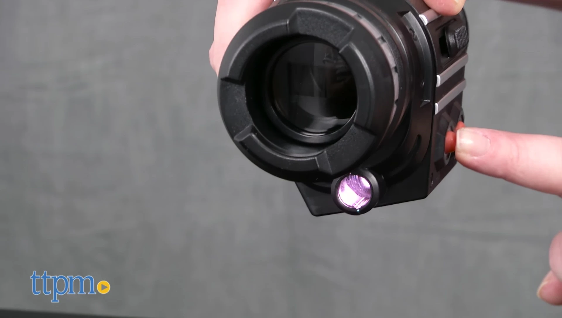 The SpyX Power Scope being held in a hand