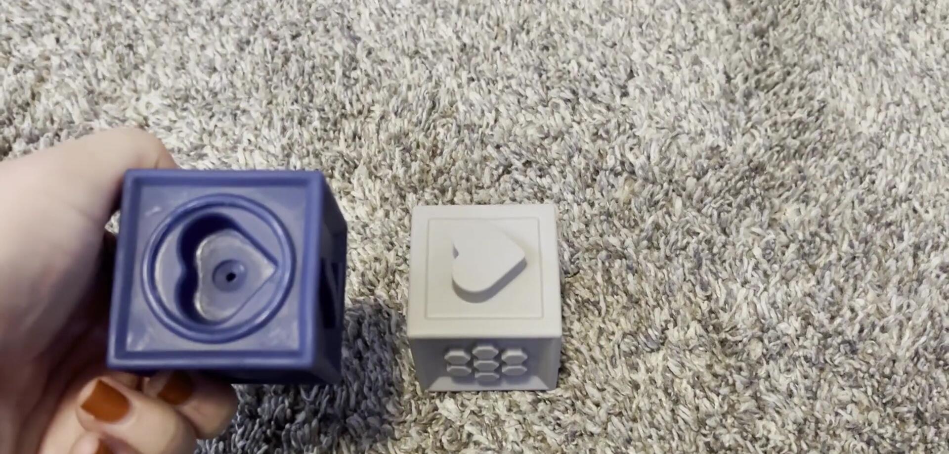 The colorful cubes showcasing animals, fruits, and numbers.