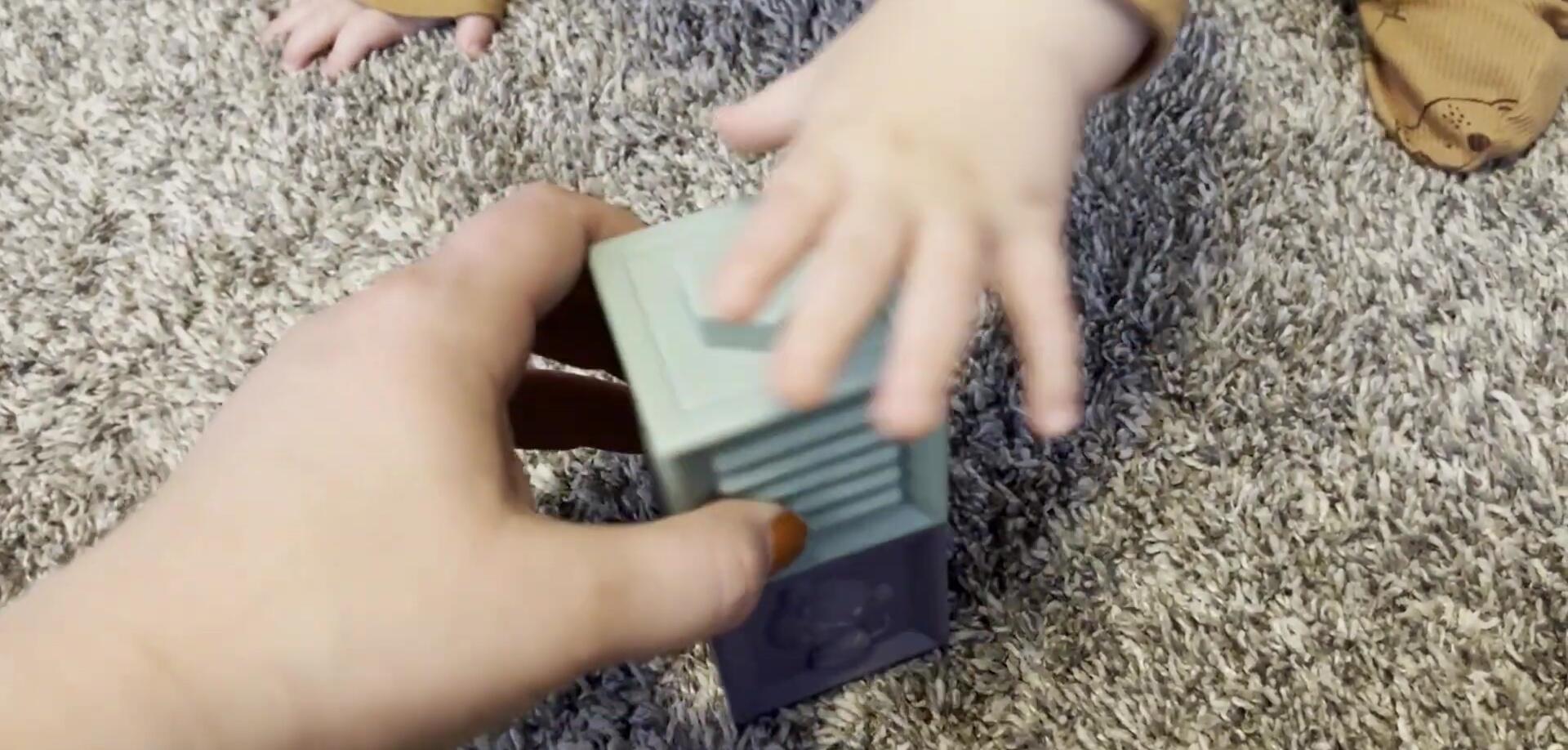 Demonstrating the difficulty in stacking some of the blocks.