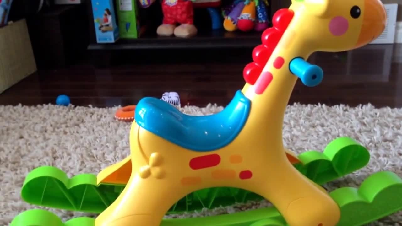 The child comfortably seated on the giraffe.