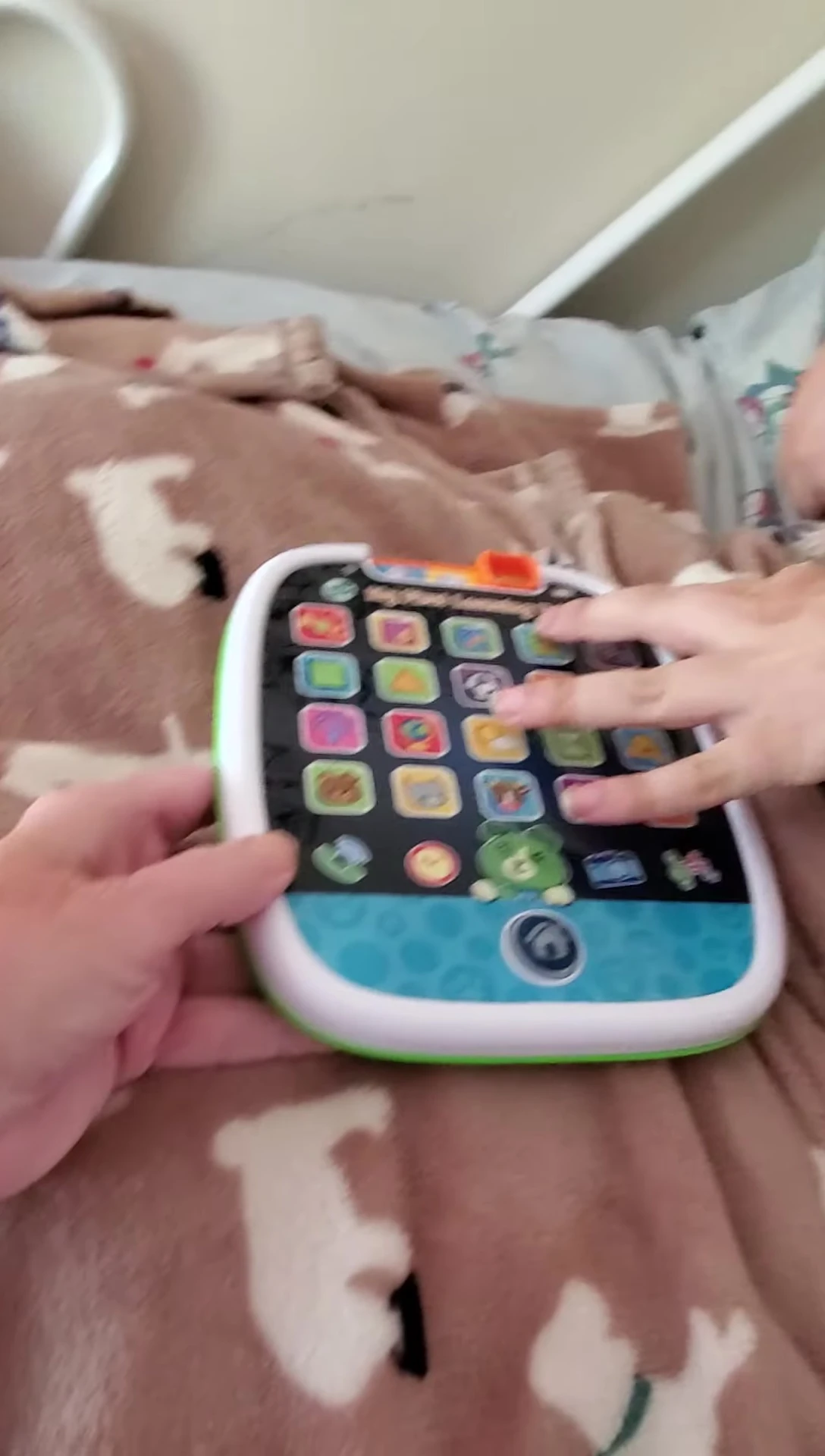 Tommy interacting with the tablet for the first time.