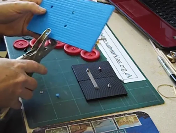 Enlarge holes (if needed) using a craft knife.