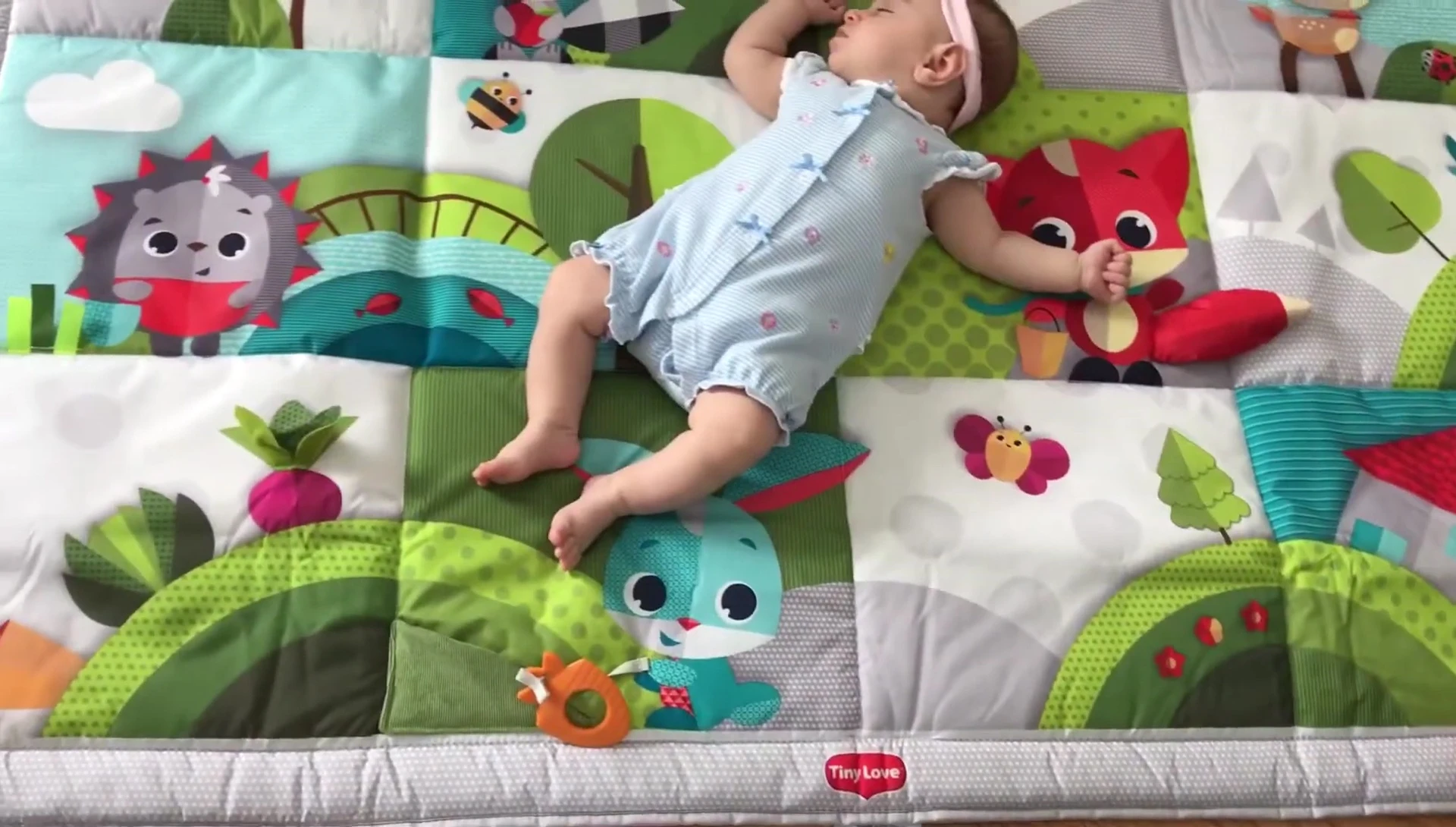 Folding up the play mat.