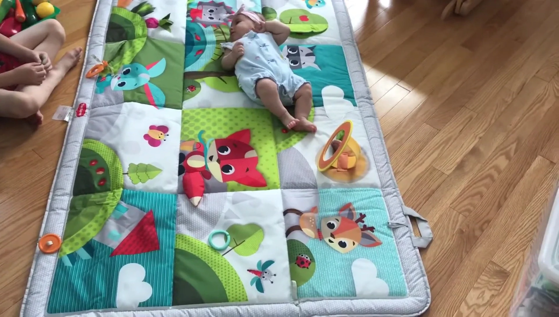 Baby interacting with the mat's elements.