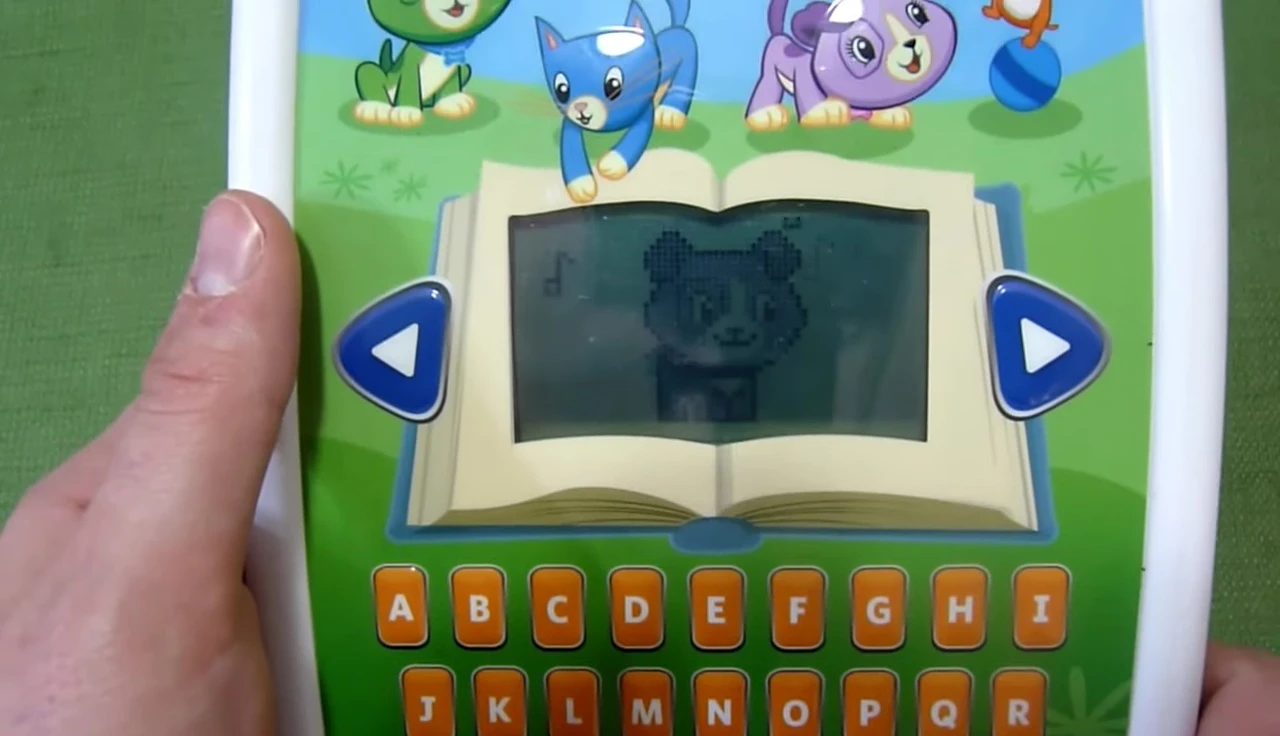 The interactive musical keyboard and drum buttons are highlighted on the device.