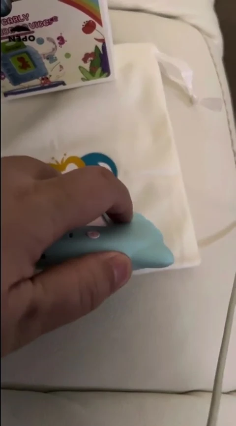 Demonstrating the process of inserting a flashcard into the device.