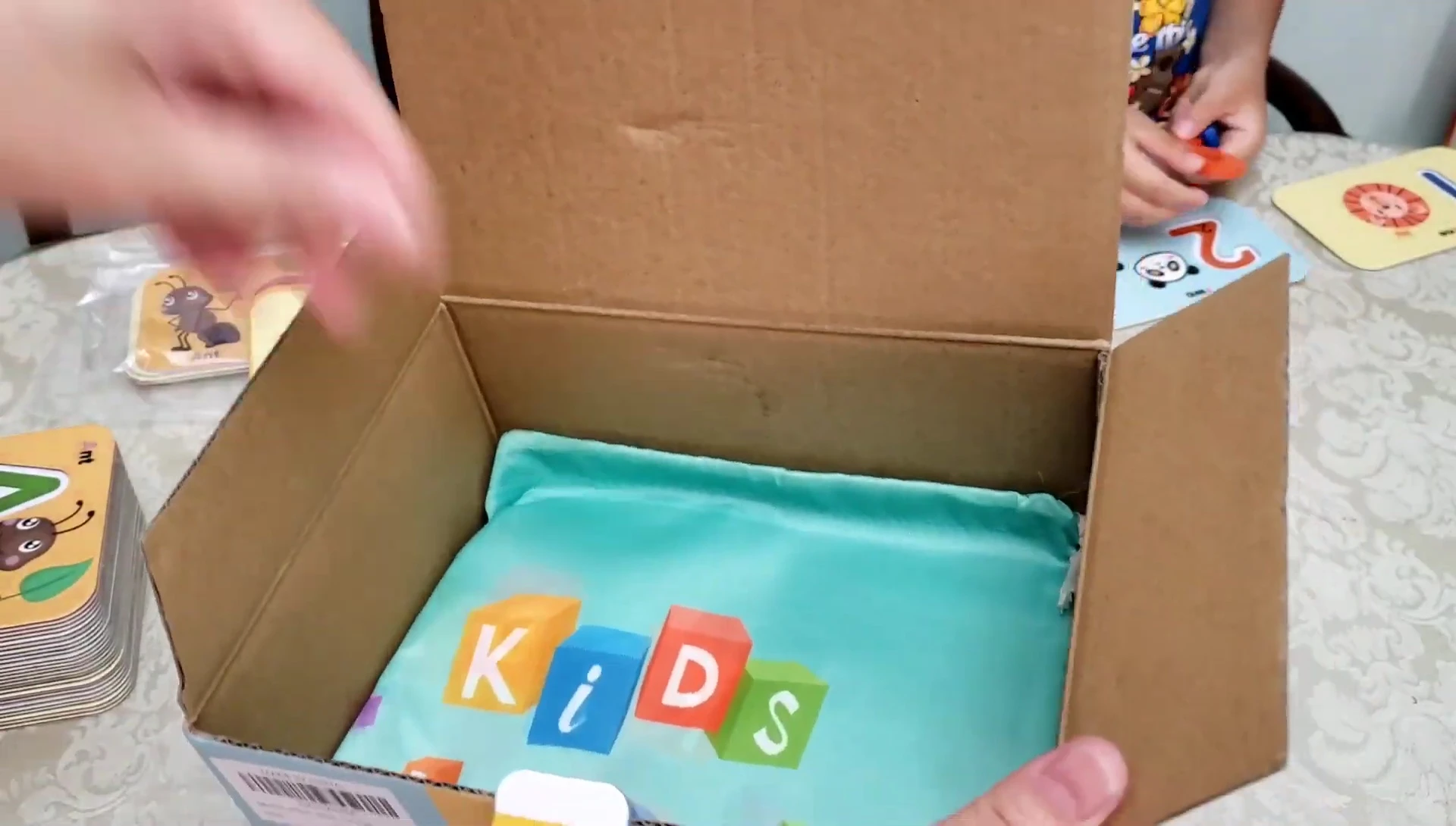 The storage bag with cards and wooden pieces inside