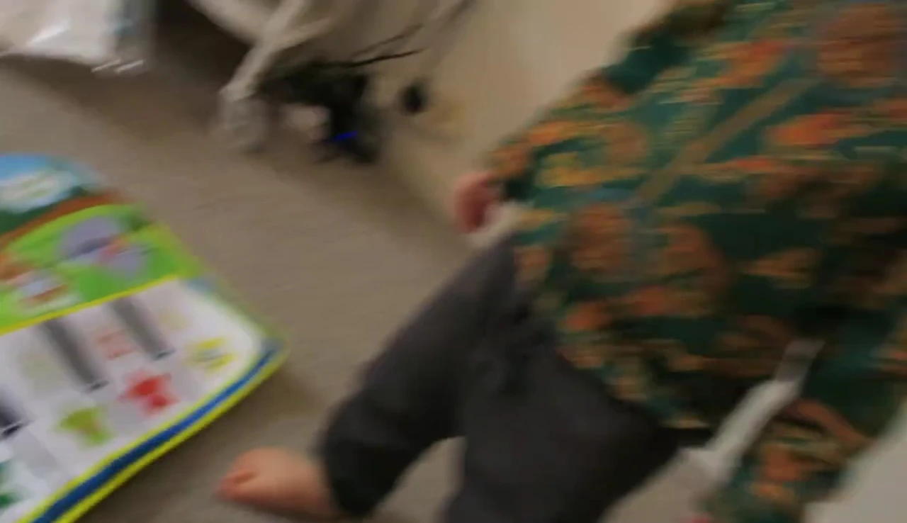 Grayson interacting with the piano mat for the first time.