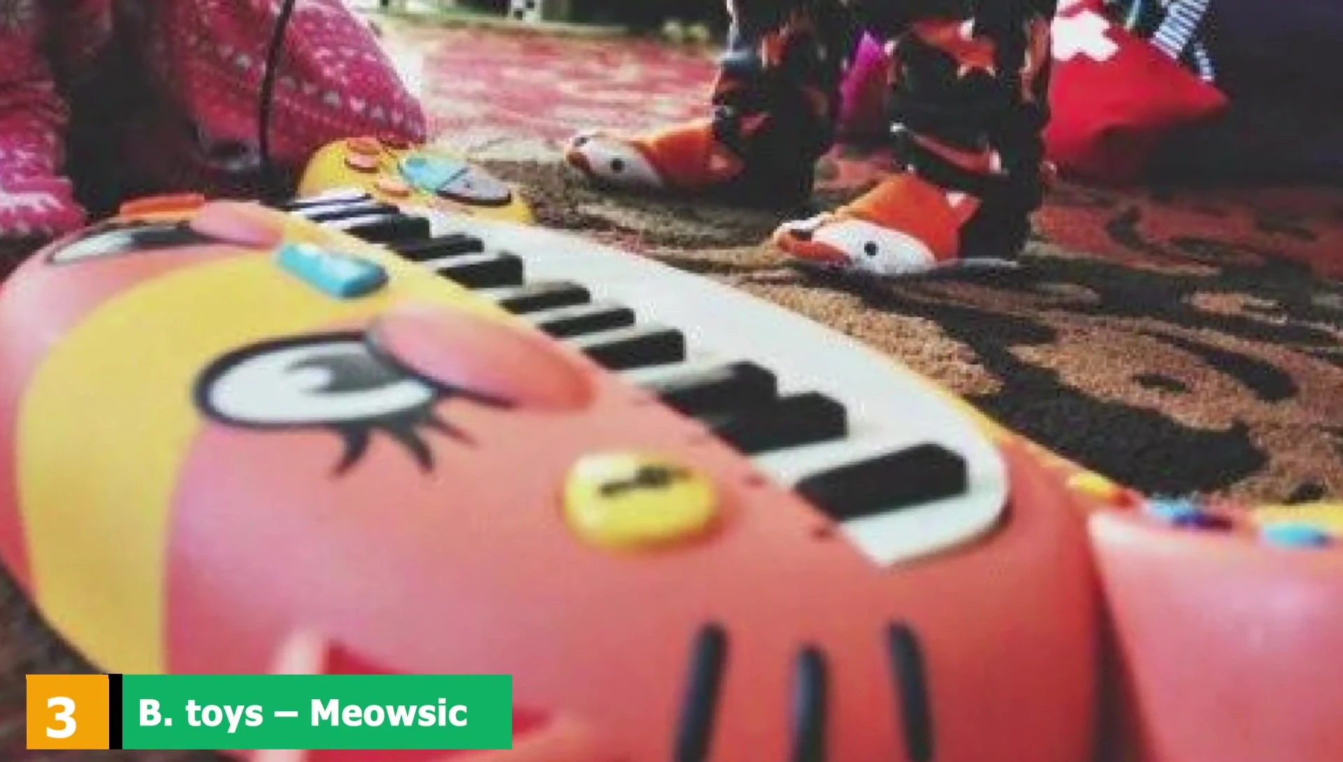 B. Toys Moosik Toy Piano displaying its various features.