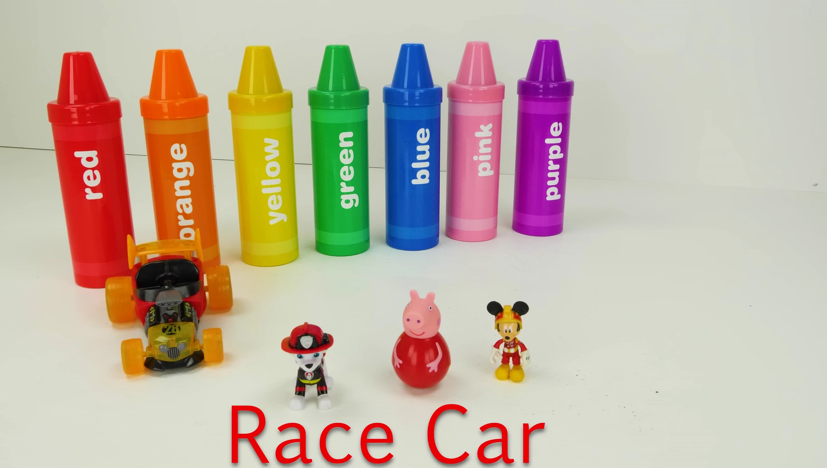 Red race car, firetruck, and playground