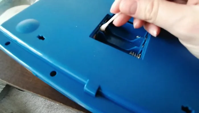 Wipe the compartment clean with a tissue.