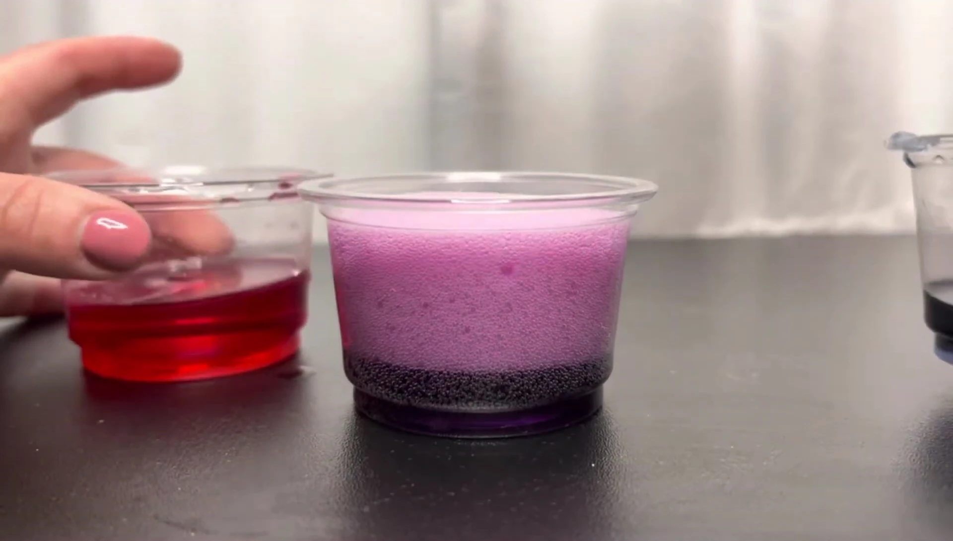 The resulting purple fizzy reaction