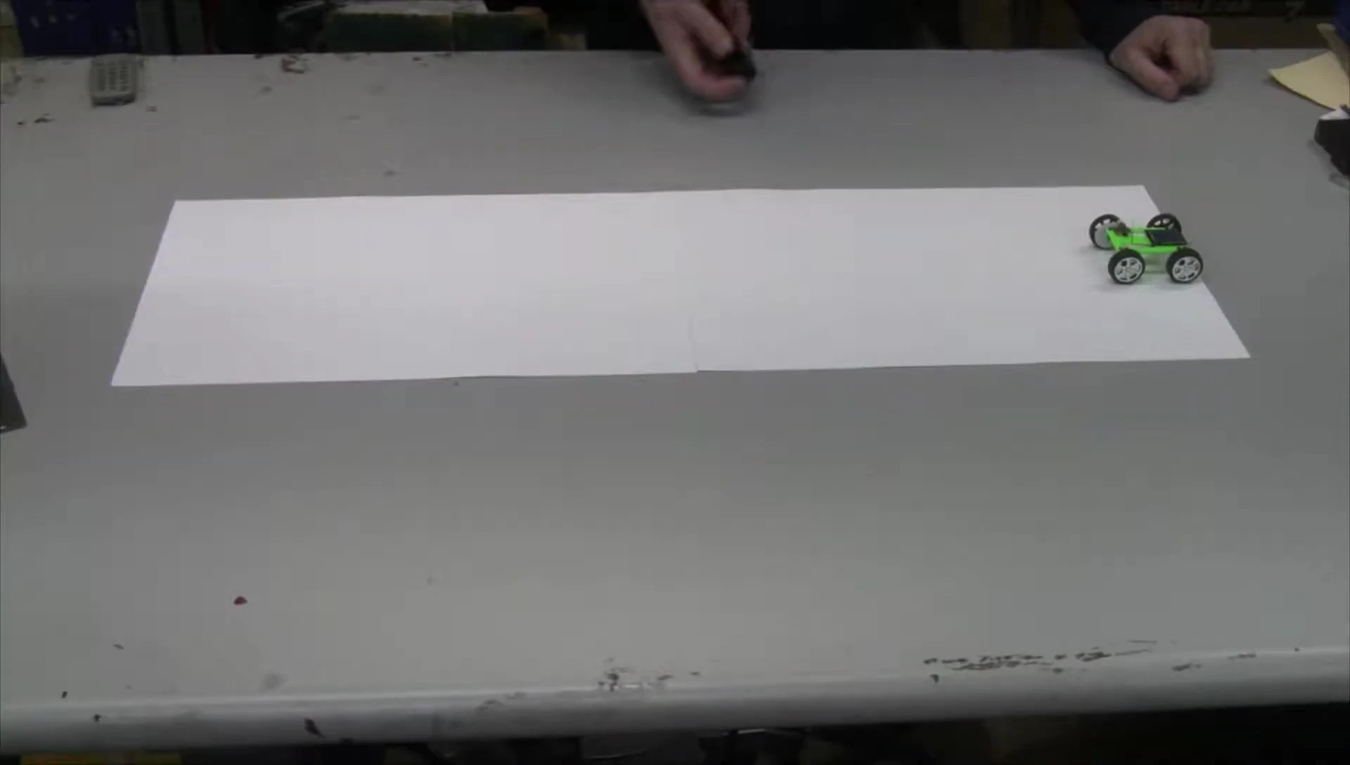 The solar car being tested under artificial light.