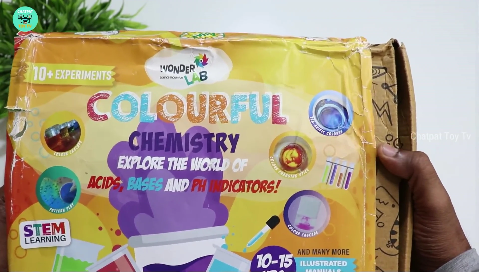 Opening the box to reveal the contents