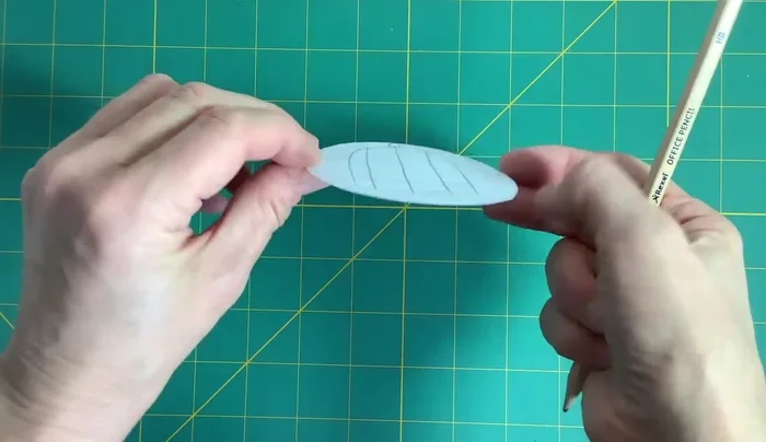 Draw a bird in the middle of the card, ensuring it's not upside down when the card is spun. Color it in.