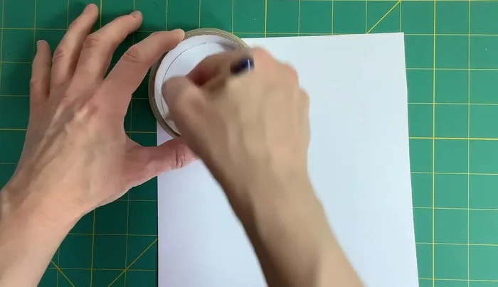 Draw a bird in the middle of the card, ensuring it's not upside down when the card is spun. Color it in.