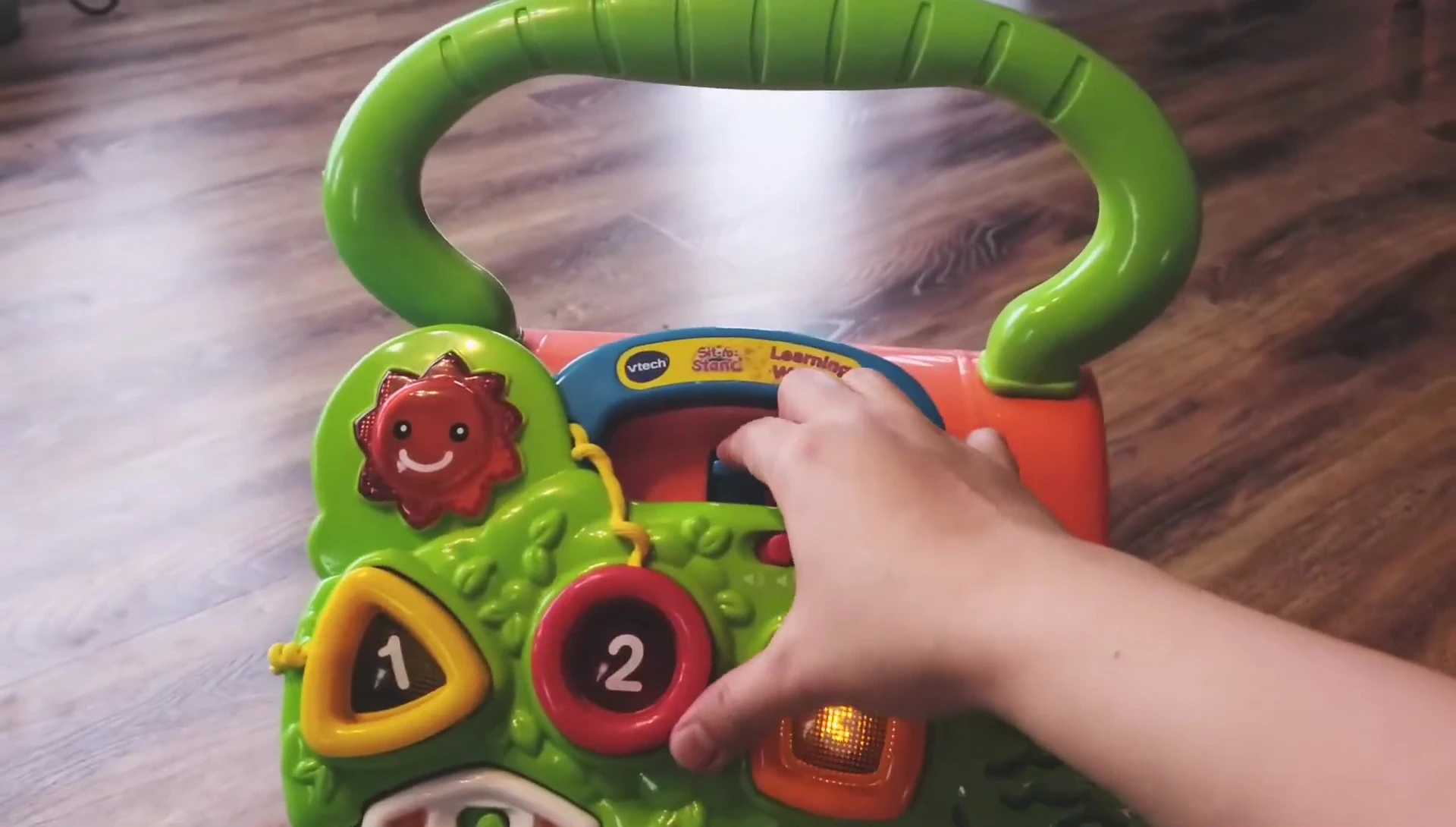 Demonstrating how to detach and reattach the toy.