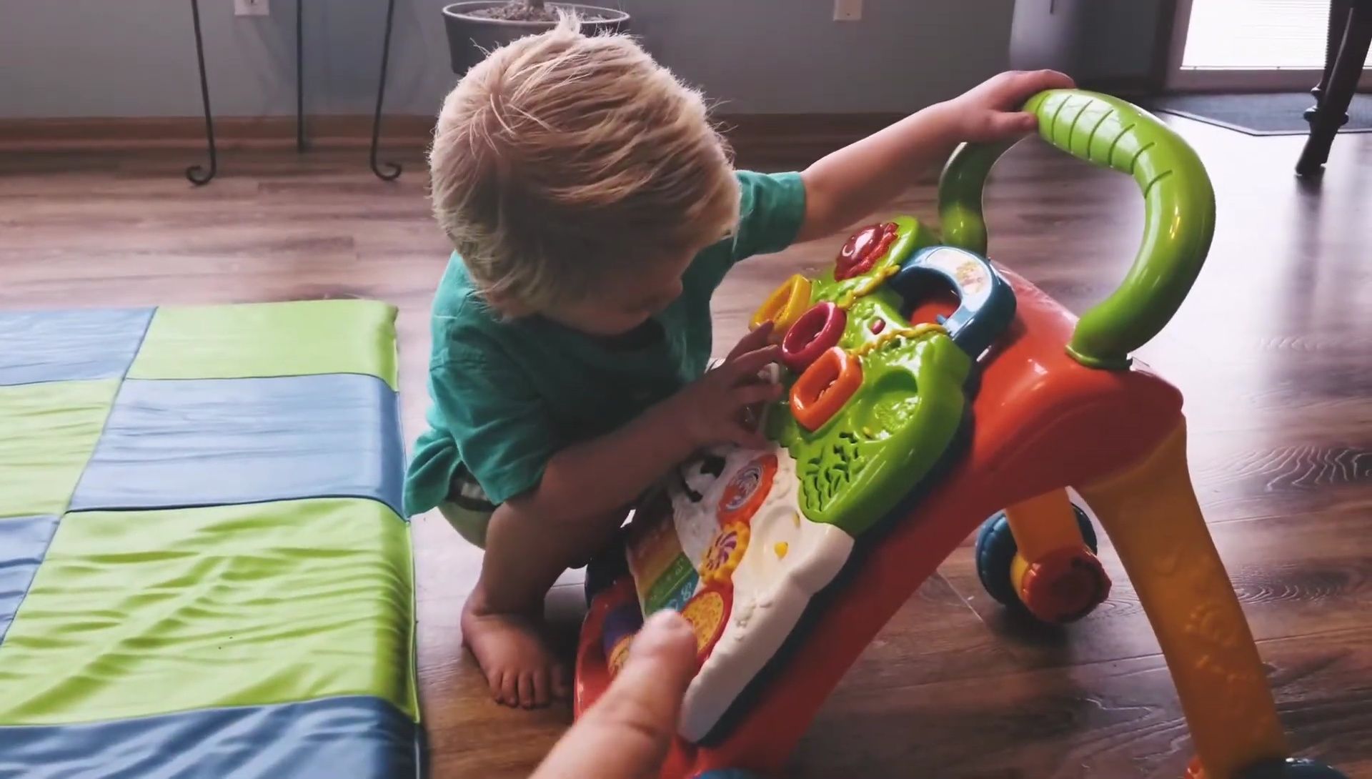 Older toddler still interacting with the walker.