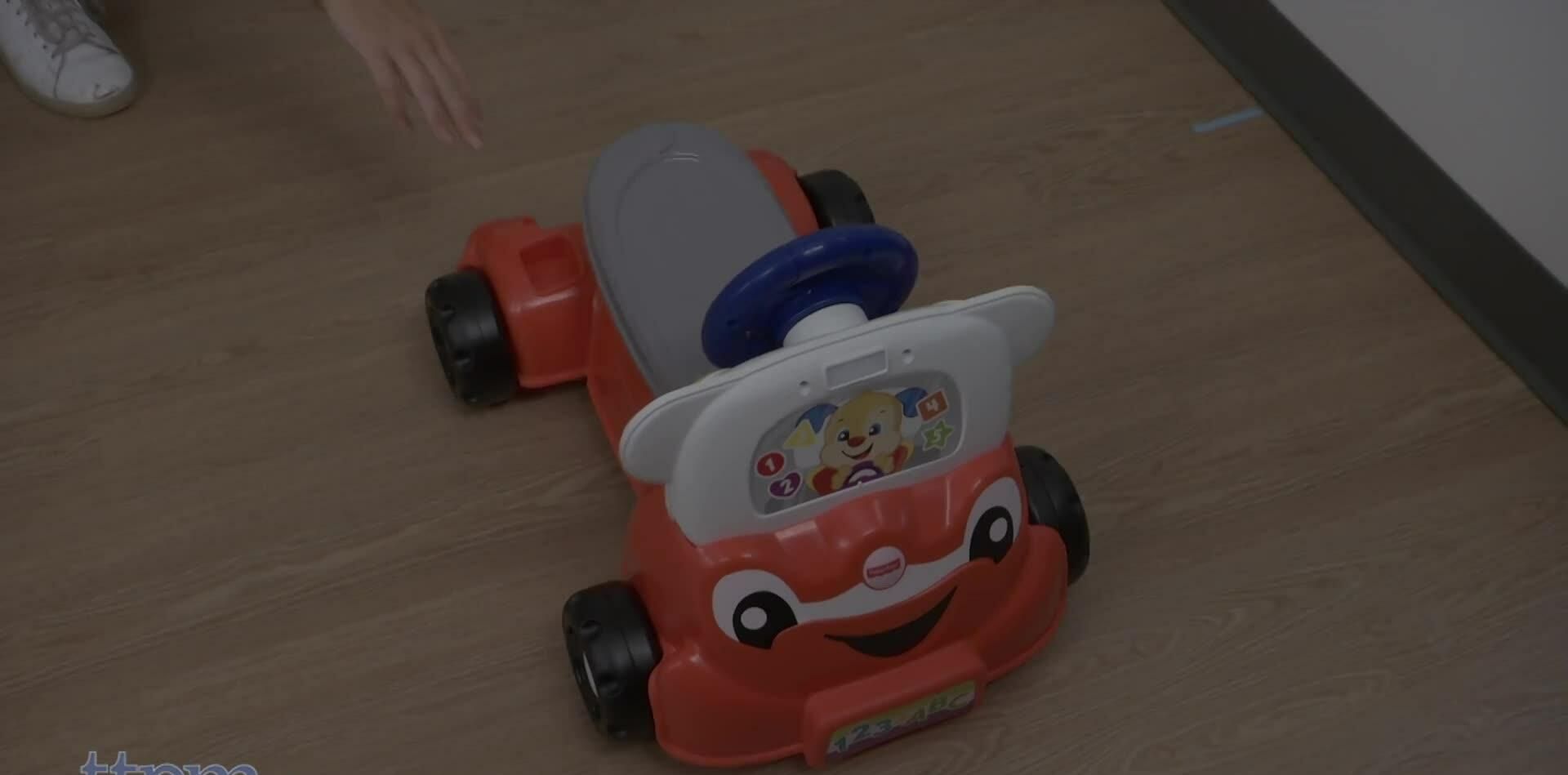 A child playing with the car