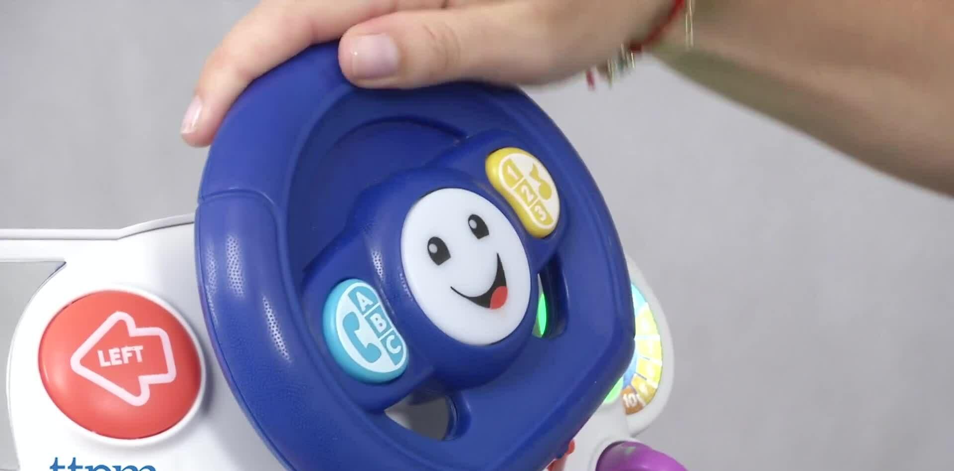 Close-up of the Smart Stages button on the Fisher-Price Smart Car