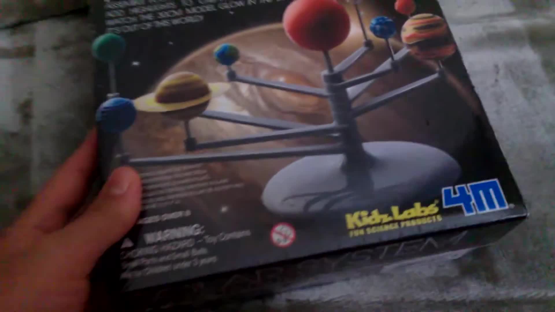 Close-up of the packaging and contents of the Solar System Planetarium Kit