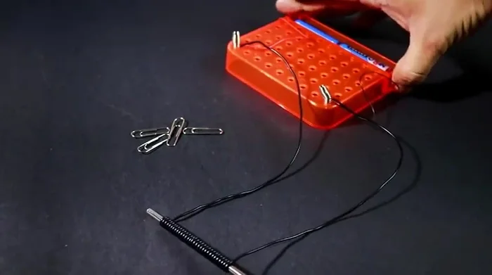 Test the electromagnet with an iron pin.